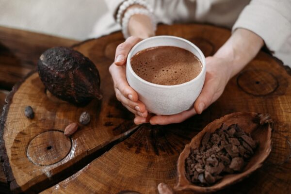 Hot,Handmade,Ceremonial,Cacao,In,White,Cup.,Woman,Hands,Holding